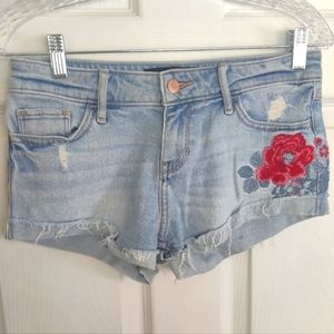 Hollister jeans shorts with floral design.